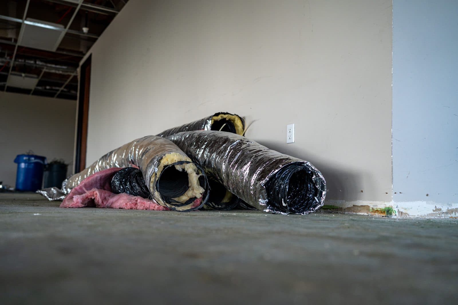Coils of insulated flex duct on a commercial floor